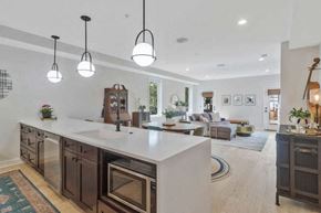 Washington house for rent - a large kitchen with a center island and a living room