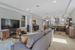 Washington house for rent - a living room with a couch and a television