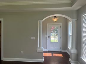 Baker house for rent - a view of the entryway of a house with a white door