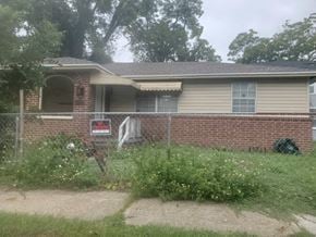 Jacksonville house for rent - a house with a fence in front of it