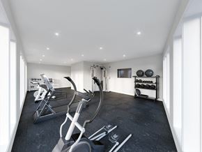 Winnipeg apartment for rent - A modern home gym with treadmills and elliptical machines.
