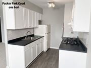 Philadelphia apartment for rent - a kitchen with white cabinets and a sink and a refrigerator