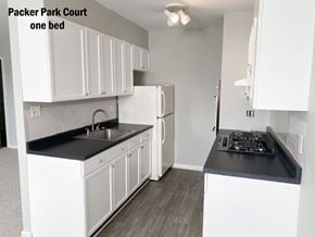 Philadelphia apartment for rent - a kitchen with white cabinets and a sink and a refrigerator