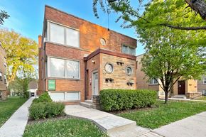 Oak Park apartment for rent - A modern brick house with a circular window design on the front.