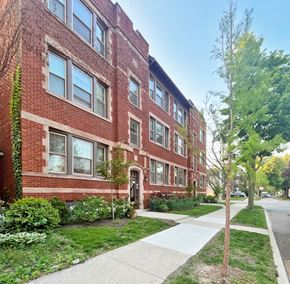 Oak Park apartment for rent - A red brick building with a tree in front of it.