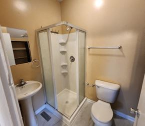 Hammond apartment for rent - a small bathroom with a shower toilet and sink