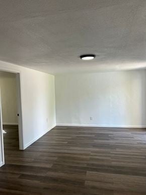 Fort Myers apartment for rent - A room with a wooden floor and a ceiling light.