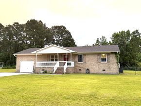 Jacksonville house for rent - a small brick house with a yard in front of it