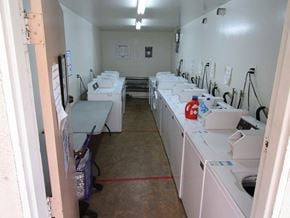 Sherman Oaks apartment for rent - A laundromat with rows of washers and dryers.