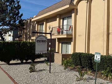Sherman Oaks apartment for rent - A sign for a resident manager stands in front of a building.
