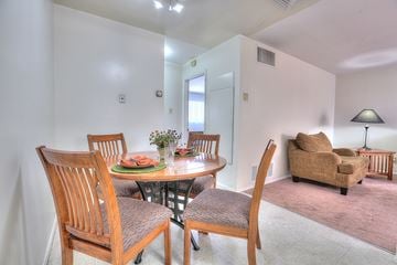 Albuquerque apartment for rent - A dining room with a round table and chairs.