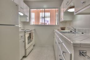 Albuquerque apartment for rent - A white kitchen with a window.