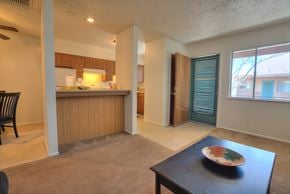 Albuquerque apartment for rent - A kitchen with a dining table and chairs.