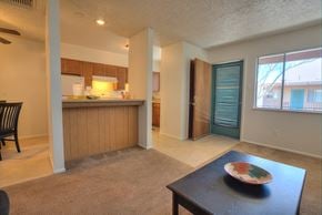 Albuquerque apartment for rent - A kitchen with a dining table and chairs.
