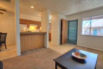 Albuquerque apartment for rent - A kitchen with a dining table and chairs.