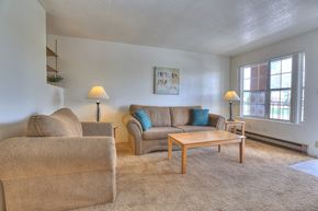 Albuquerque apartment for rent - A living room with a couch, chair, and table.
