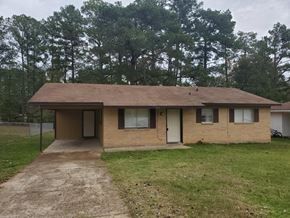 New Llano house for rent - a small brown house with a dirt road in front of it