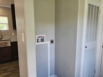 Shawnee house for rent - A white refrigerator in a kitchen with a white door.