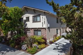 Palo Alto apartment for rent - a white and brick house with a sidewalk in front of it