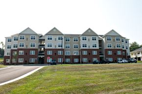 Weyers Cave apartment for rent - the exterior of an apartment building with cars parked in front