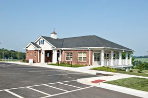 Weyers Cave apartment for rent - the front of a brick building with a porch and white columns