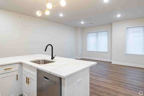 Plainfield apartment for rent - an empty kitchen with a sink and a window