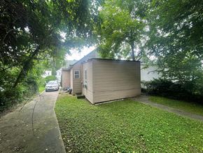 New Albany house for rent - a small house on the side of a sidewalk