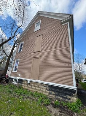 Syracuse apartment for rent - the side of a house with brown siding