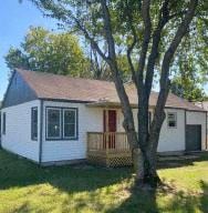 Springfield house for rent - a small white house with a tree in front of it
