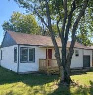 Springfield house for rent - a small white house with a tree in front of it