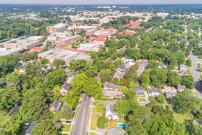 Greenville apartment for rent - A bird's eye view of a university campus with buildings and trees.