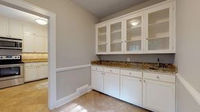 Greenville apartment for rent - A kitchen with white cabinets and granite countertops.