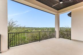 Horseshoe Bay house for rent - a covered porch with a view of the grass and trees
