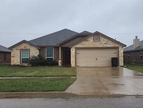 Killeen house for rent - a house with a driveway and a garage door