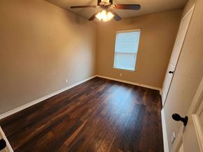 Killeen house for rent - a living room with hard wood floors and a ceiling fan