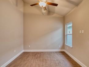 San Antonio apartment for rent - the spacious living room with hardwood floors and a ceiling fan