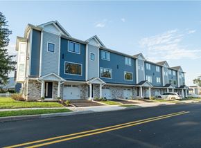 South Bound Brook apartment for rent - A row of houses with garages and driveways.