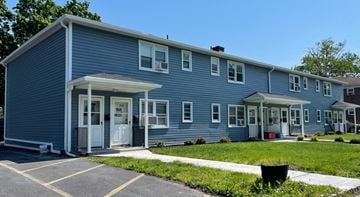 South Bound Brook apartment for rent - A blue building with a white door and windows.