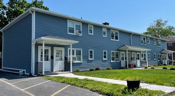 South Bound Brook apartment for rent - A blue building with a white door and windows.