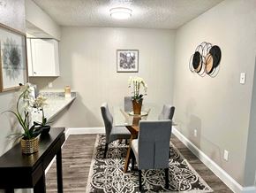 Irving house for rent - a dining room with a table and chairs