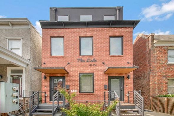 Washington house for rent - the front of a brick building with two windows
