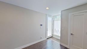 Denver house for rent - a living room with white walls and a door to a balcony