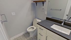 Denver house for rent - a bathroom with a toilet and a sink