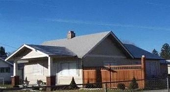 Spokane Valley house for rent - a house with a gray roof and a wooden fence
