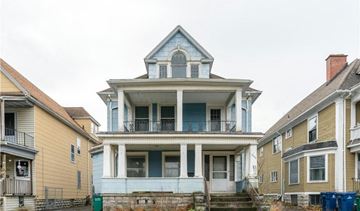 Buffalo apartment for rent - a blue and white house with a porch