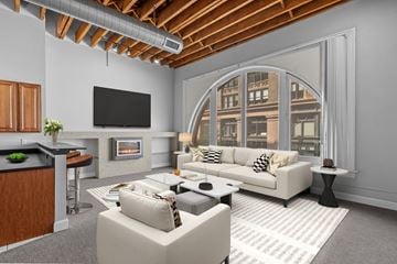 St. Louis apartment for rent - a living room with a large window and a couch and a table