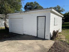 Gary house for rent - a small white building with a white door