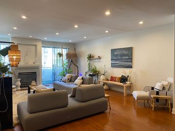 Los Angeles apartment for rent - a living room with couches and chairs and a fireplace