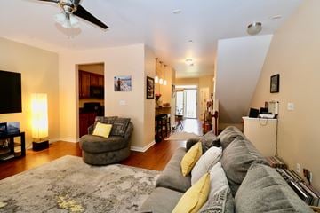 Newport News house for rent - a living room with a couch and a chair and a ceiling fan