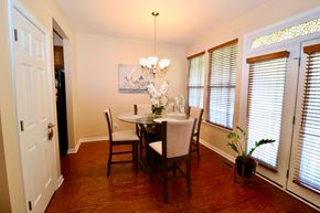 Newport News house for rent - a dining room with a table and chairs and a chandelier